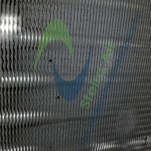 Clean HVAC coil with visible patterns, showcasing the effectiveness of steam cleaning by Steira Air, emphasizing eco-friendly maintenance and improved air quality.