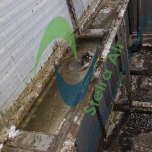 Dirty HVAC coils with visible grime and buildup, showcasing the need for steam cleaning; Steira Air logo prominently displayed.