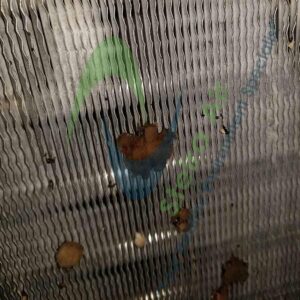 Dirty HVAC coil with debris and contaminants, illustrating the need for effective steam coil cleaning services by Steira Air.